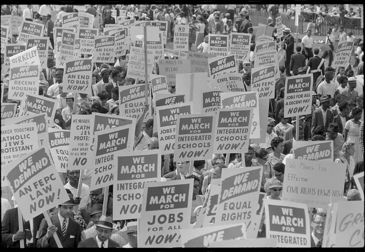 Photo of people holding signs during a Civil Rights protest and march