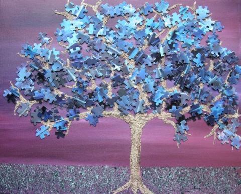 Image of painted tree with puzzle piece leaves
